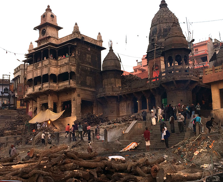 The most sacred cremation place in India: Manikarnika Ghat in Varanasi, where funeral pyres burn day and night.