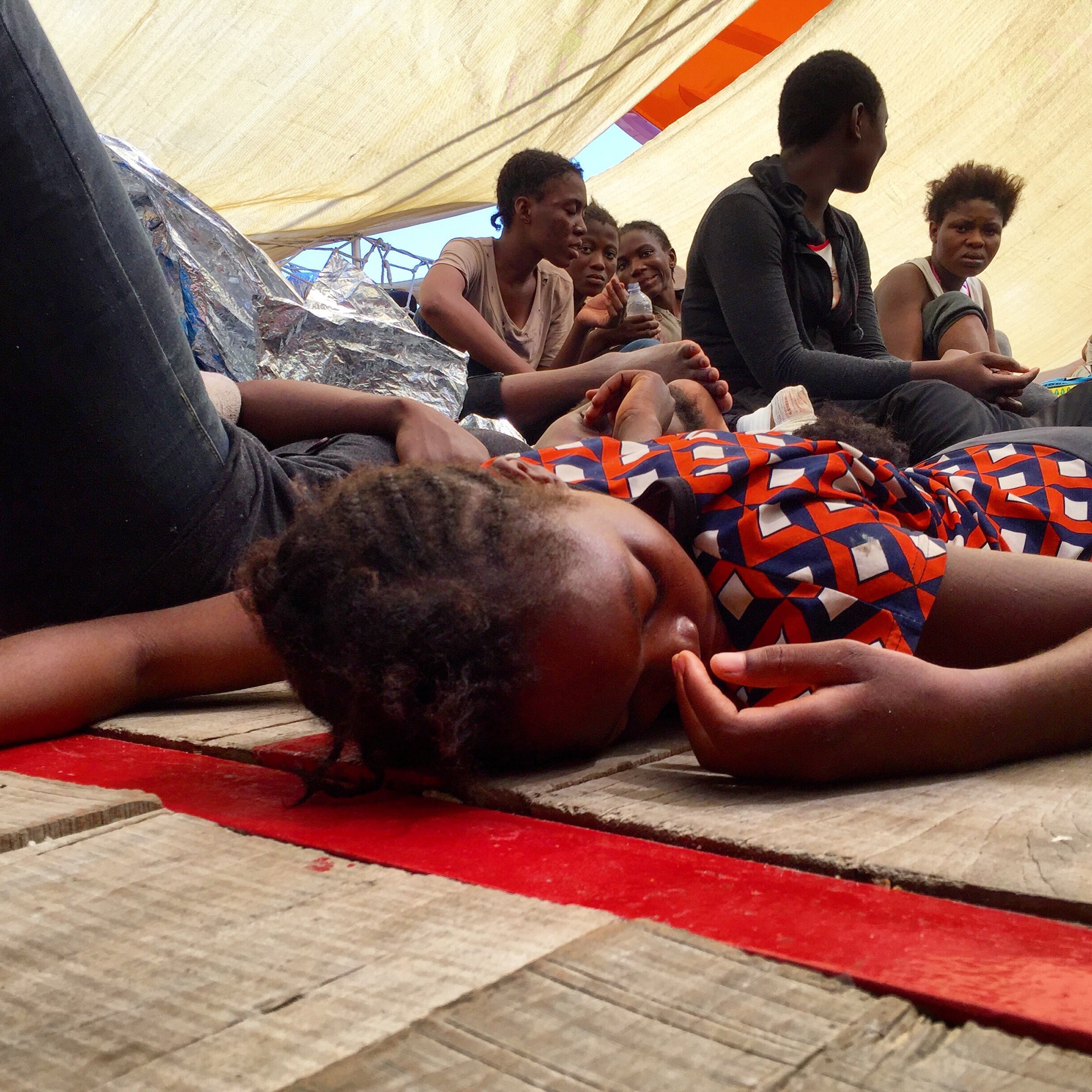 Eva, a Nigerian woman, gets some much needed sleep after being rescued at sea.